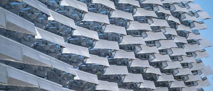 Close-up of geometric sunshades on the exterior of a modern building.
