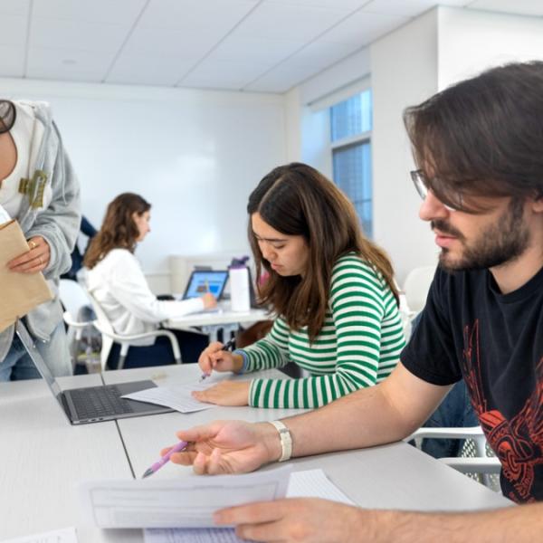 A color photo showing students working.