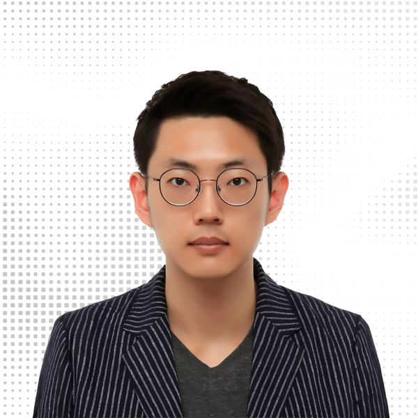 A color photo of a man with glasses.