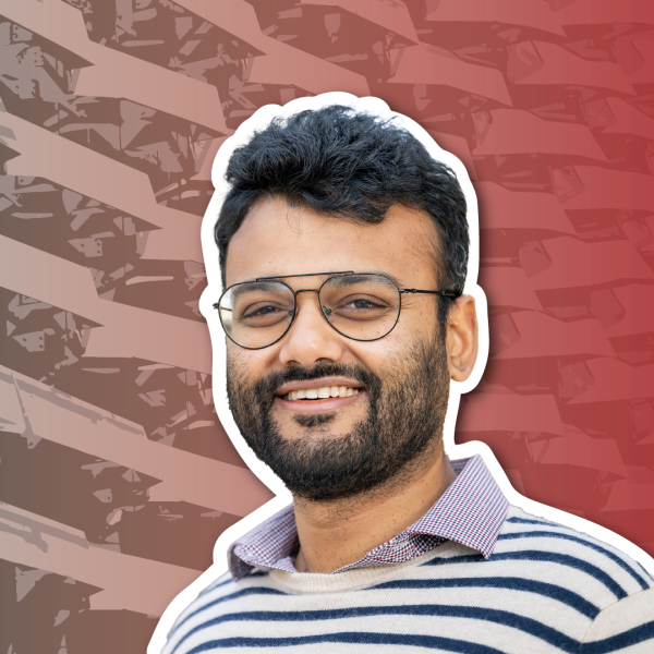 An image of a tan man with dark hair wearing glasses against a red and gray faded background