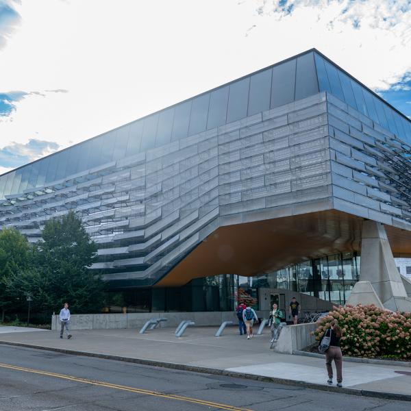 South view of Gates Hall (showing fins) on a sunny day.