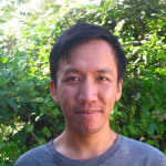 A photo of Justin Hsu, a man with short dark hair in front of a leafy background