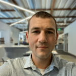 A photo of Nate Foster, a man with short brown hair and a gray shirt.