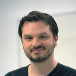 A photo of Abe Davis, a man with dark brown hair.