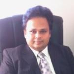 Man in suit sitting in chair