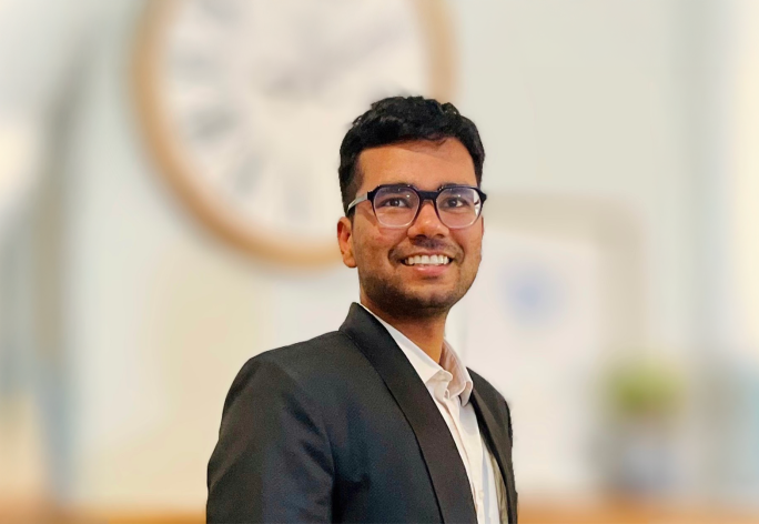 A color photo of Devansh Agarwal in front of a blurred background