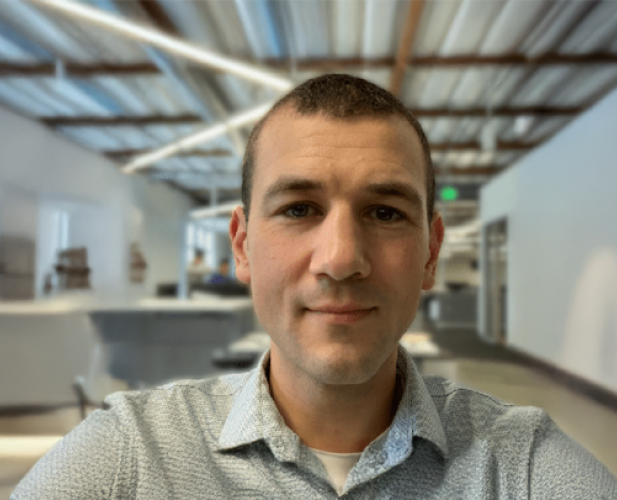 A photo of Nate Foster, a man with short brown hair and a gray shirt.