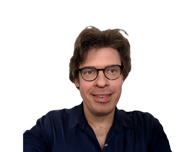 A photo of Immanuel Trummer, a man with brown hair, glasses, in front of a white background