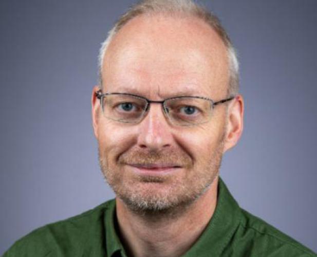 Portrait of man with glasses and graying hair 